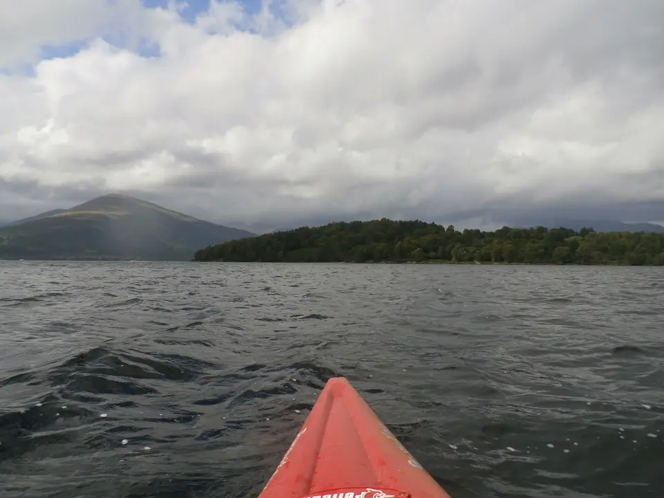 Inchlonaig island in Loch Lomond seen across the water