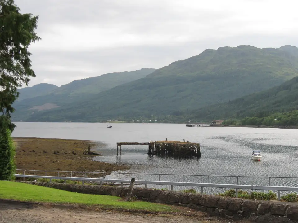 Loch Long at Arrochar with a small pier and hills across the water