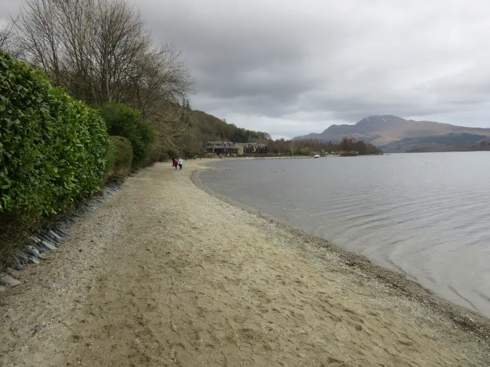 Luss beach, a pebble-and-sand shore with hills across the loch