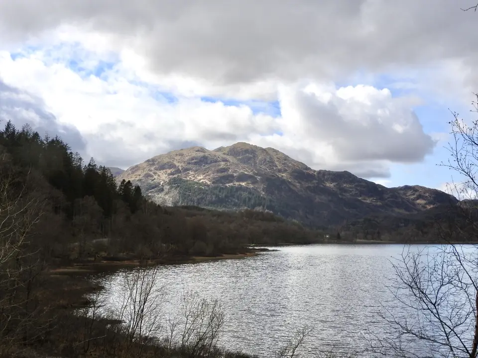 Ben Venue rising beyond the water of Loch Achray in the Trossachs