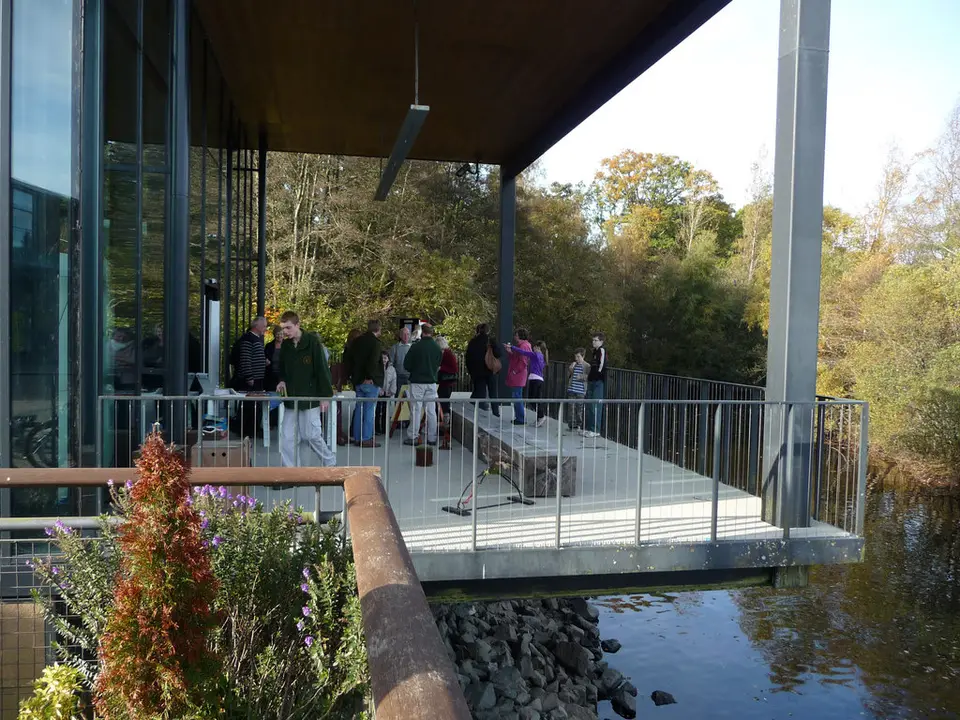 Visitors watching a raptor display from a deck at Lomond Shores beside Loch Lomond