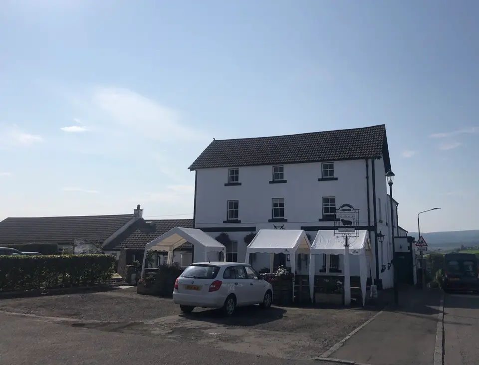 The Black Bull, the old drovers' inn on the main street at Gartmore, seen from across the road in daylight