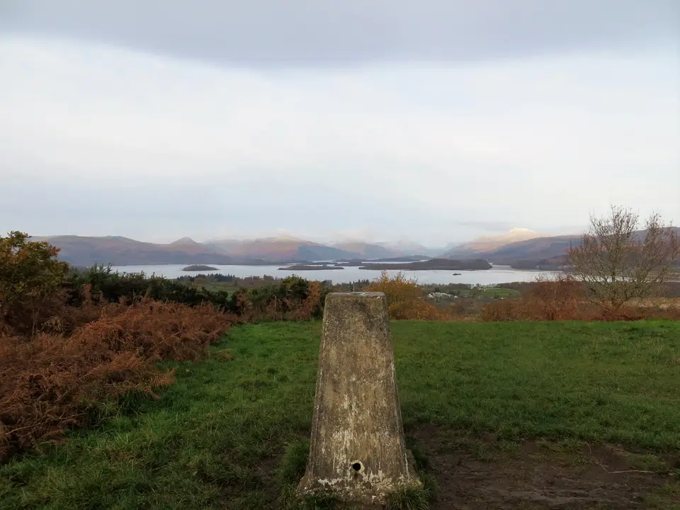 The trig pillar on top of Duncryne Hill with Loch Lomond and its islands beyond