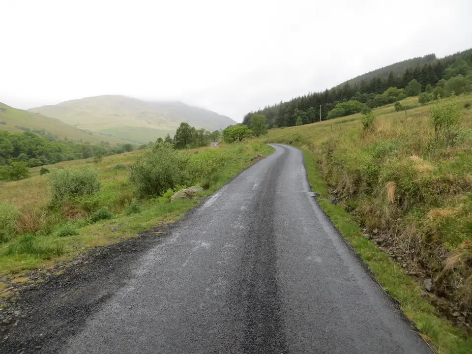 A minor road climbing away from Inverbeg into Glen Douglas between hills