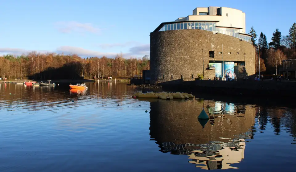 The SEA LIFE building at Loch Lomond Shores reflected in the water